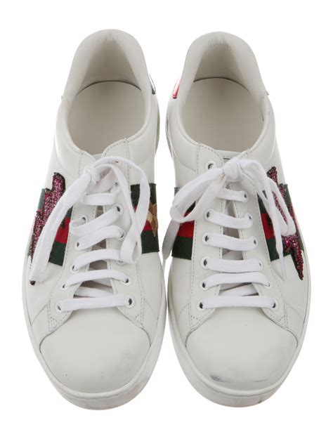 gucci ace embroidered sneakers.